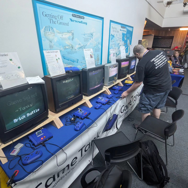 The GameTank Booth at LIRetro, featuring Burdock in front of the AVHG setup